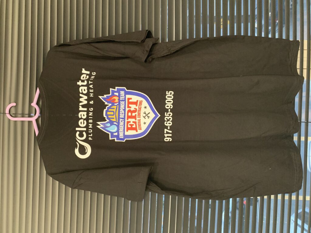 Branded black t-shirt featuring a plumbing business logo
